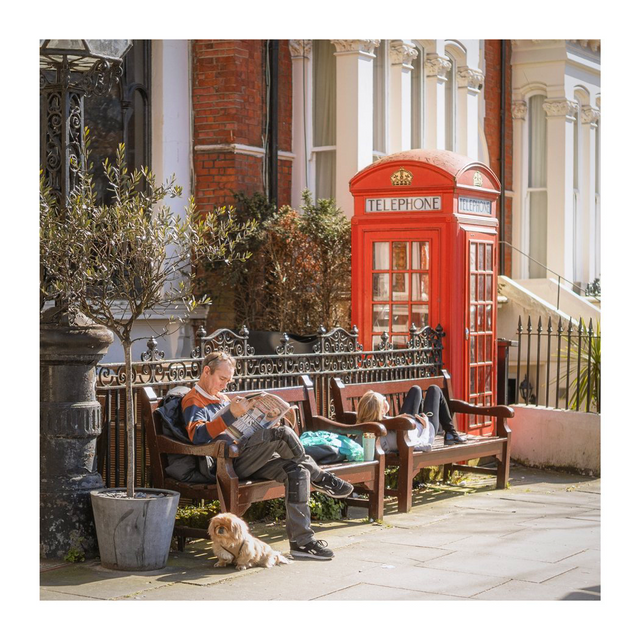 A red telephone box and a street café