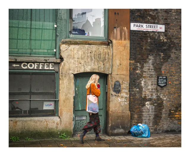 A person outside a brick building